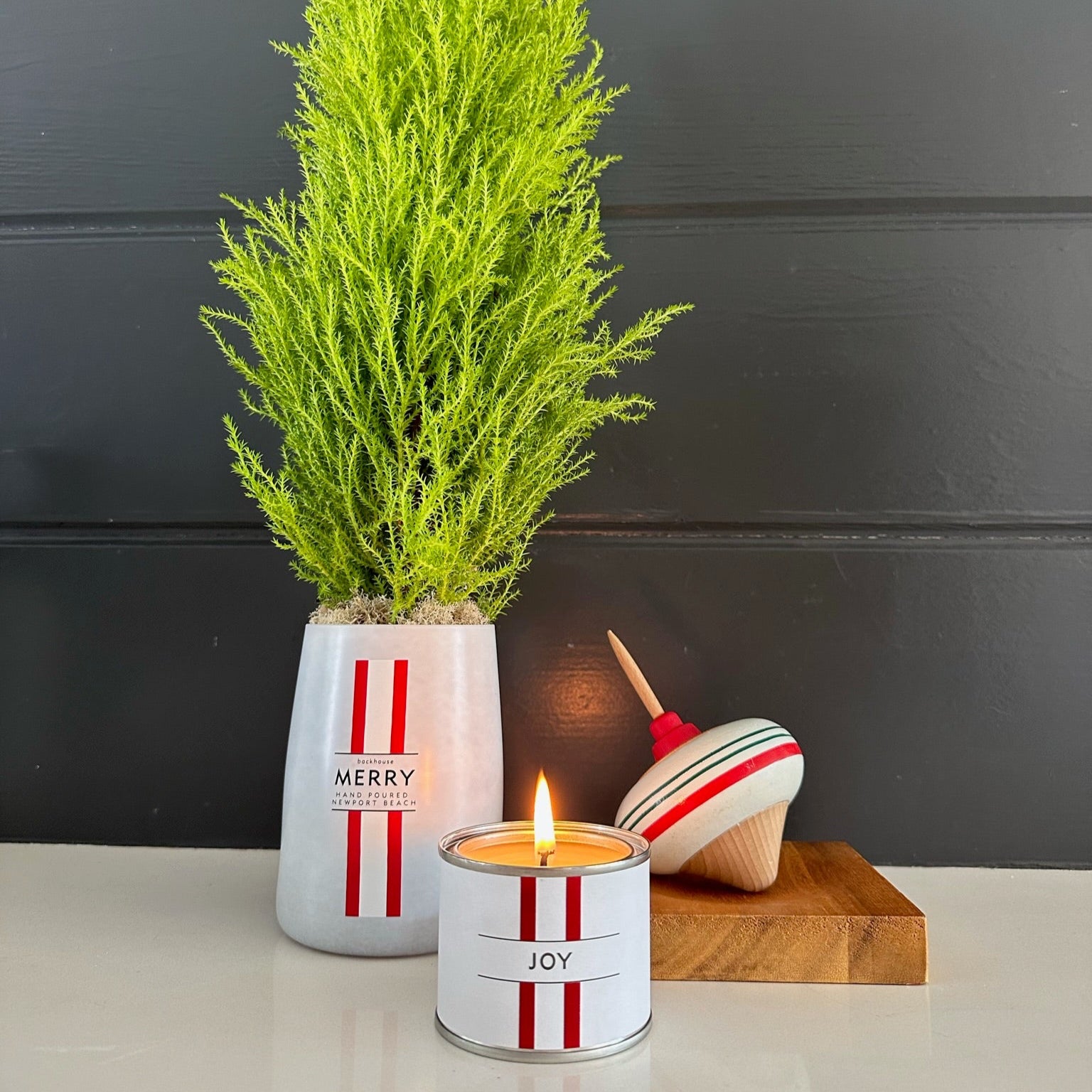 mini candle shown with other holiday decor