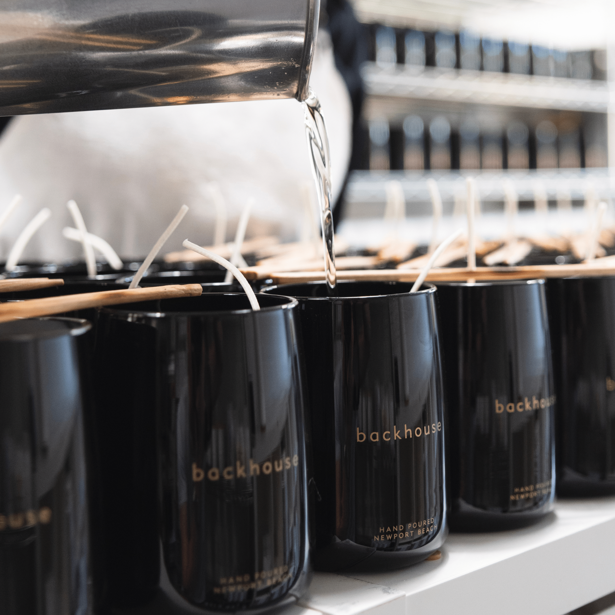 backhouse luxury black glass candles being hand-poured in Newport Beach California studio