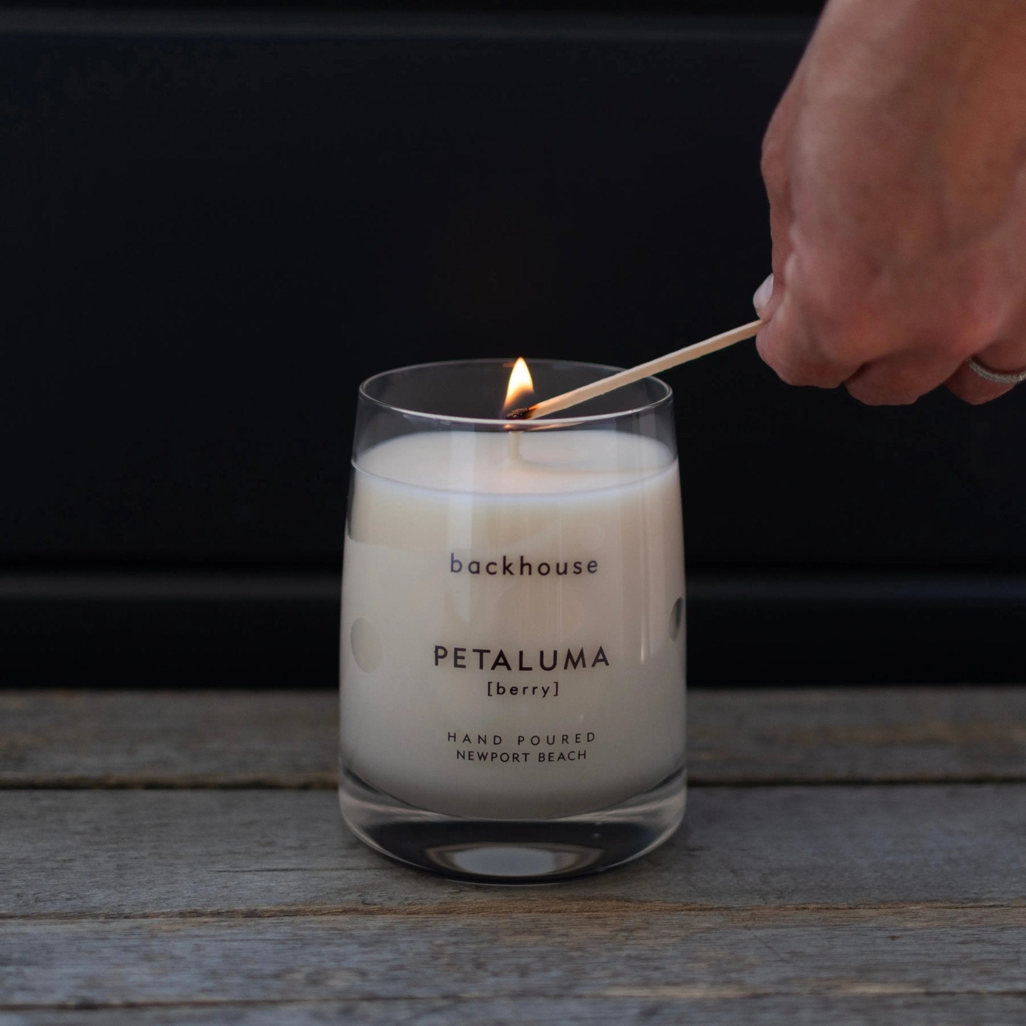 petaluma luxury berry rose candle being lit hand-poured Newport Beach backhouse fragrances