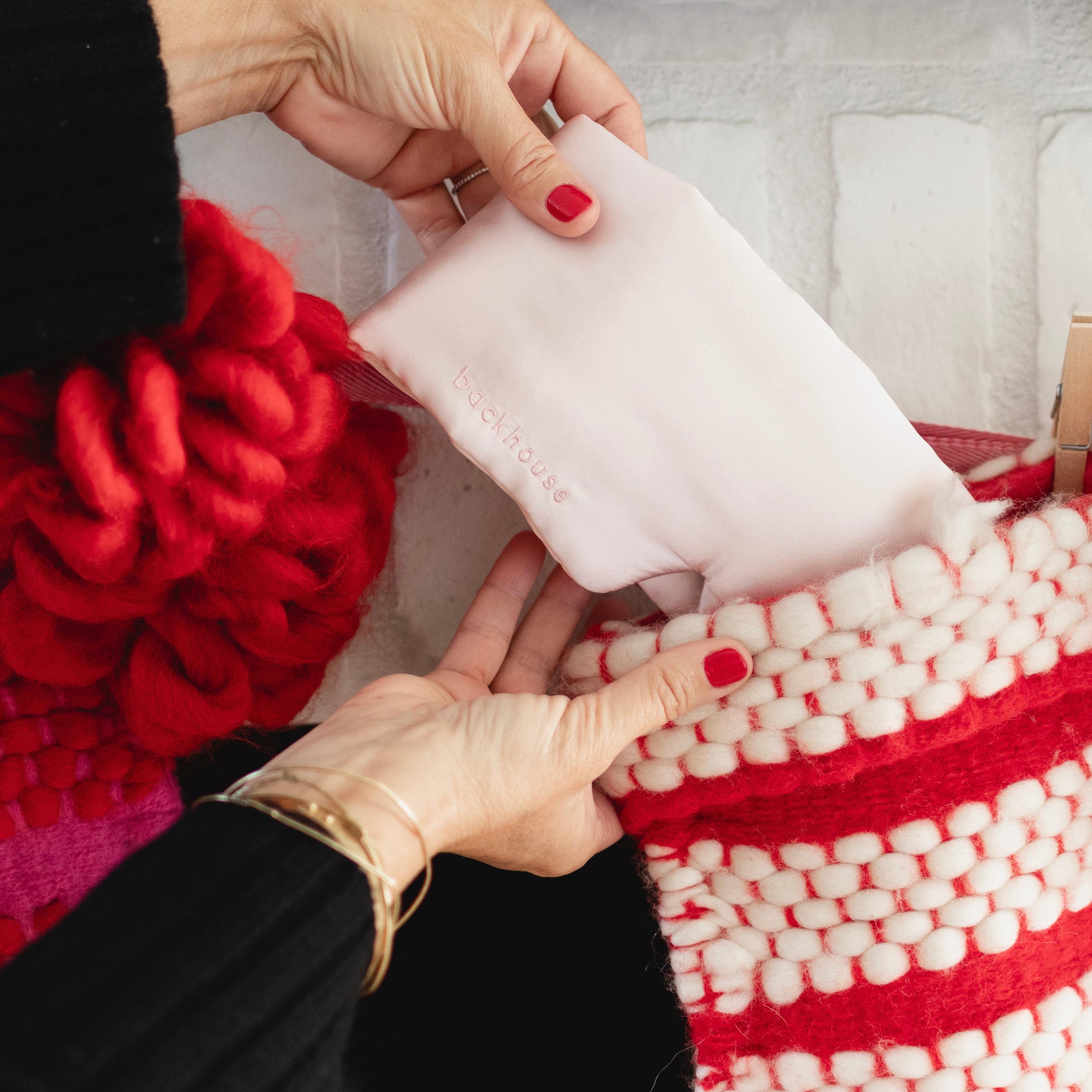 Person putting a silk eye mask into a stocking