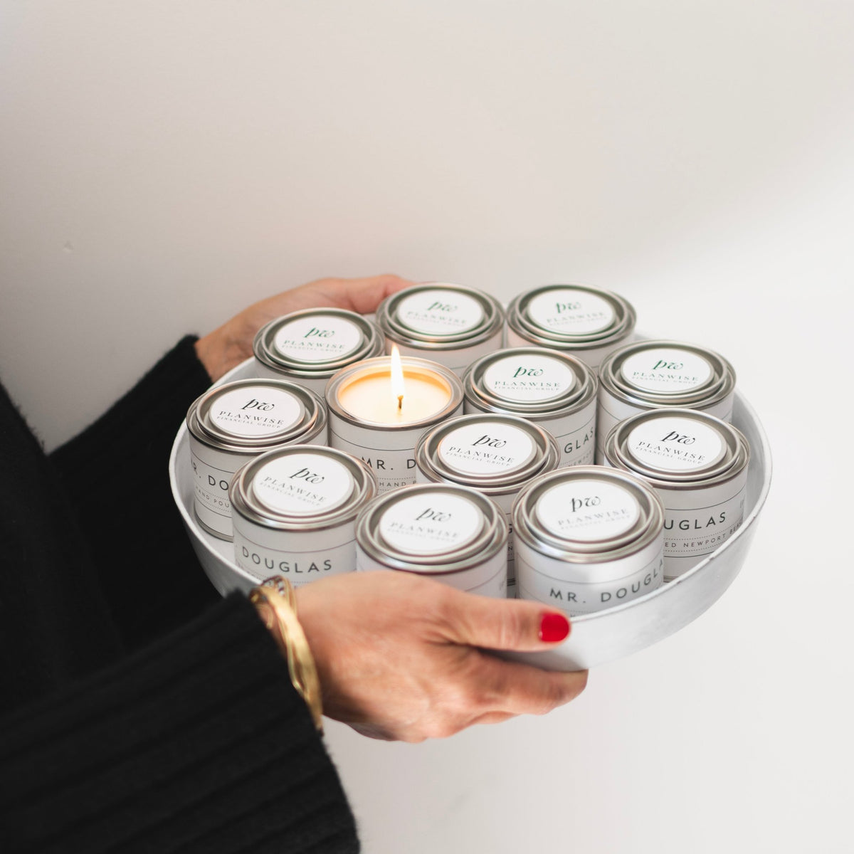 Custom branded corporate mini candles on a tray with personalized logo lids — bulk order hand-poured Newport Beach Backhouse Fragrances