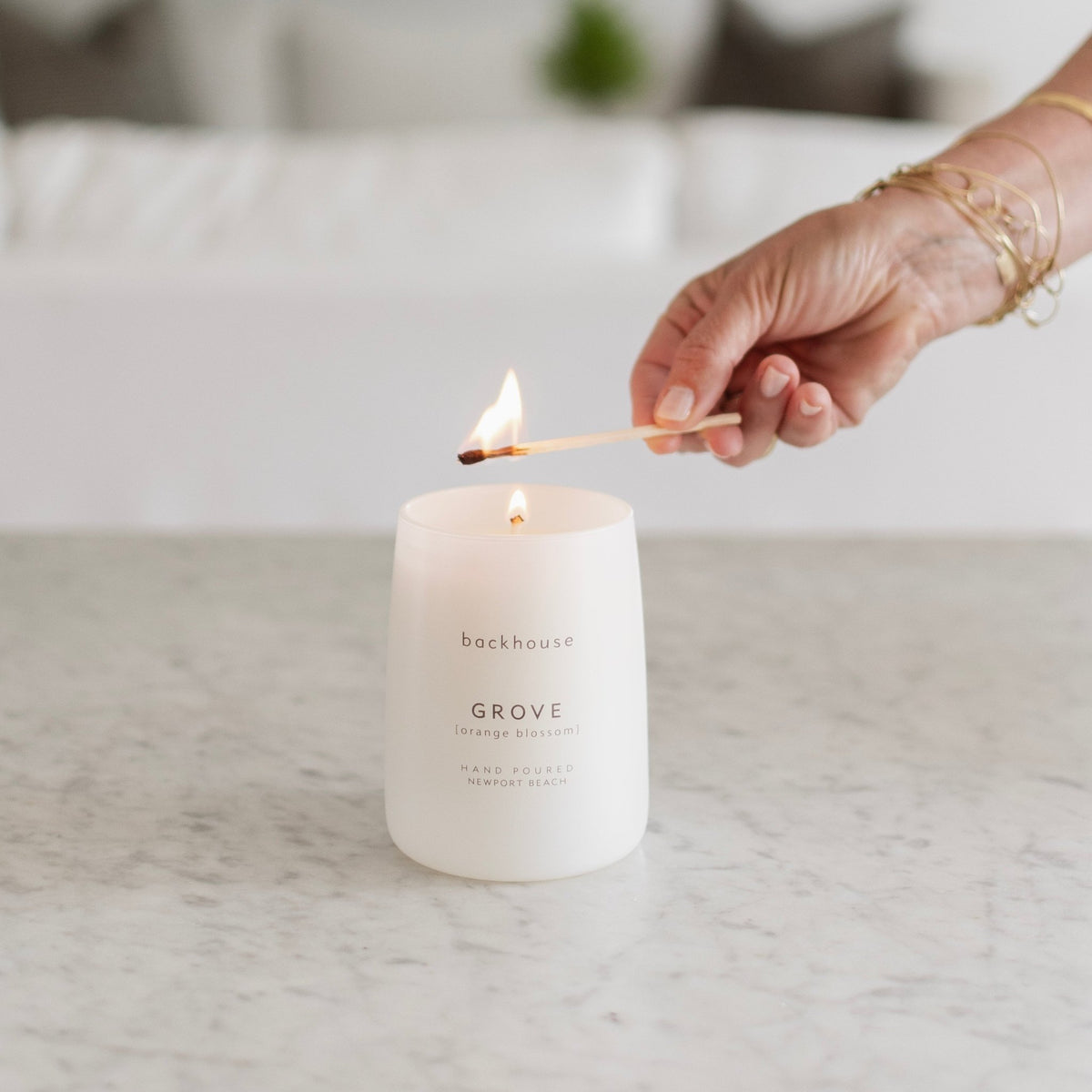 grove orange blossom luxury scented candle being lit hand-poured Newport Beach backhouse fragrances