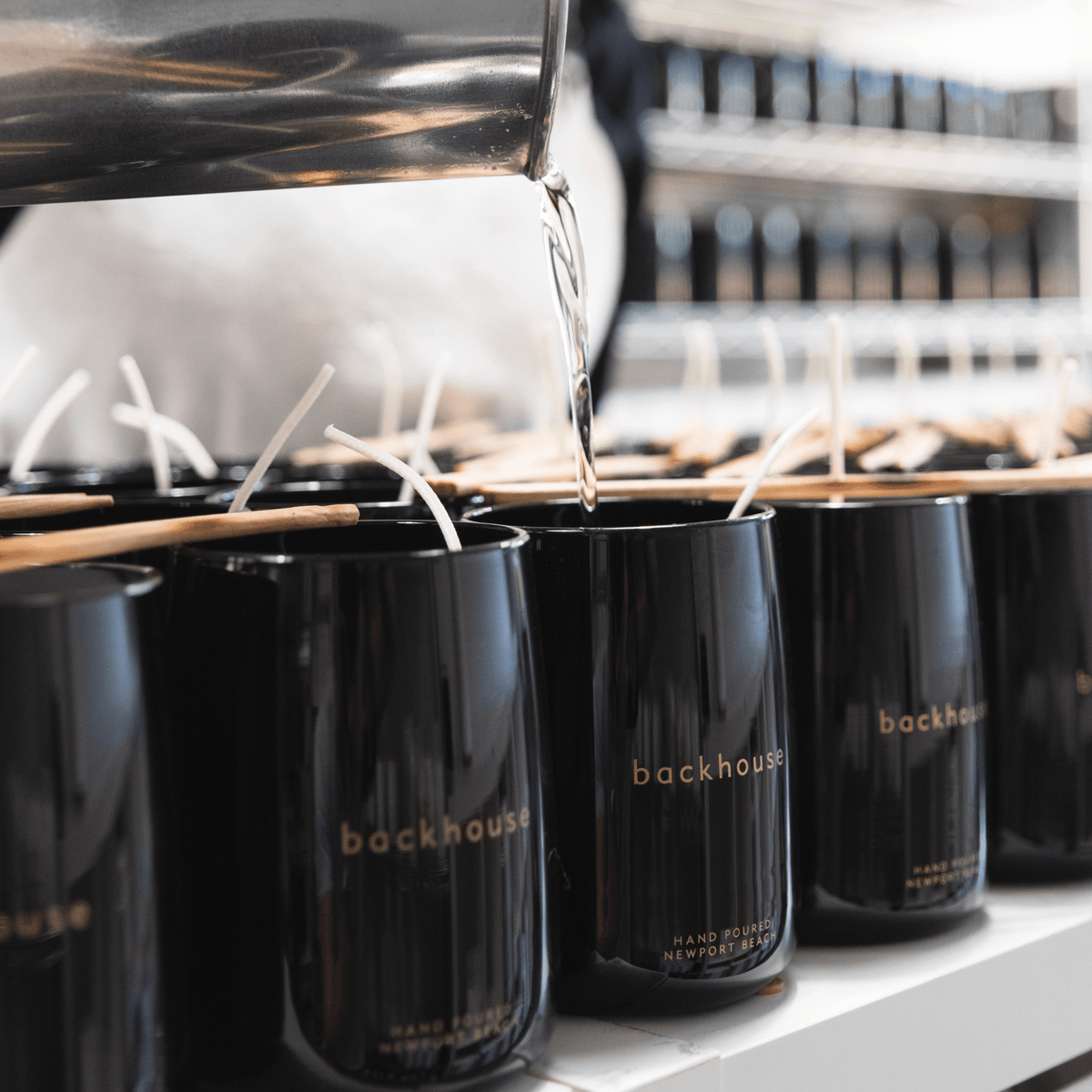 backhouse luxury black glass candles being hand-poured in Newport Beach California studio