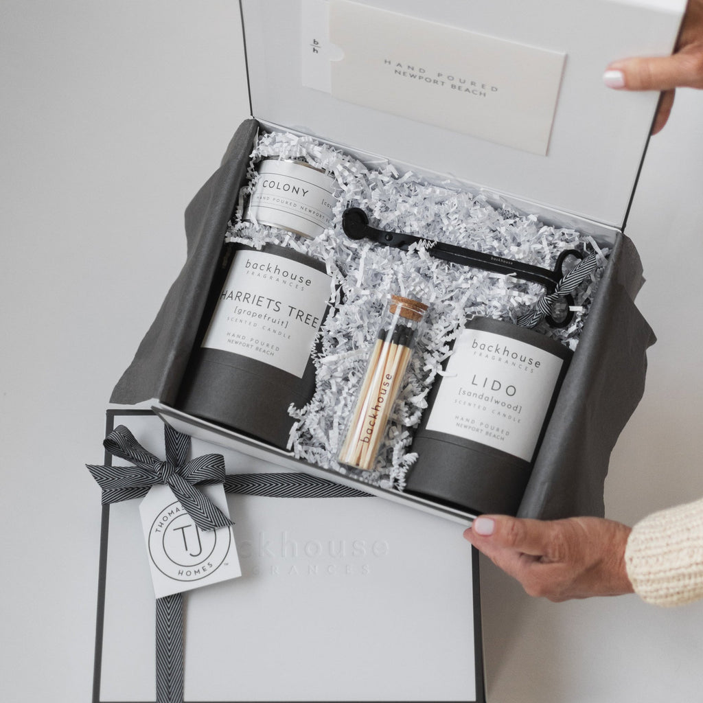 Backhouse Fragrances open Ultimate Candle Gift Box with Lido, Harriets Tree, Colony candles and matches, custom branded for TJ Homes
