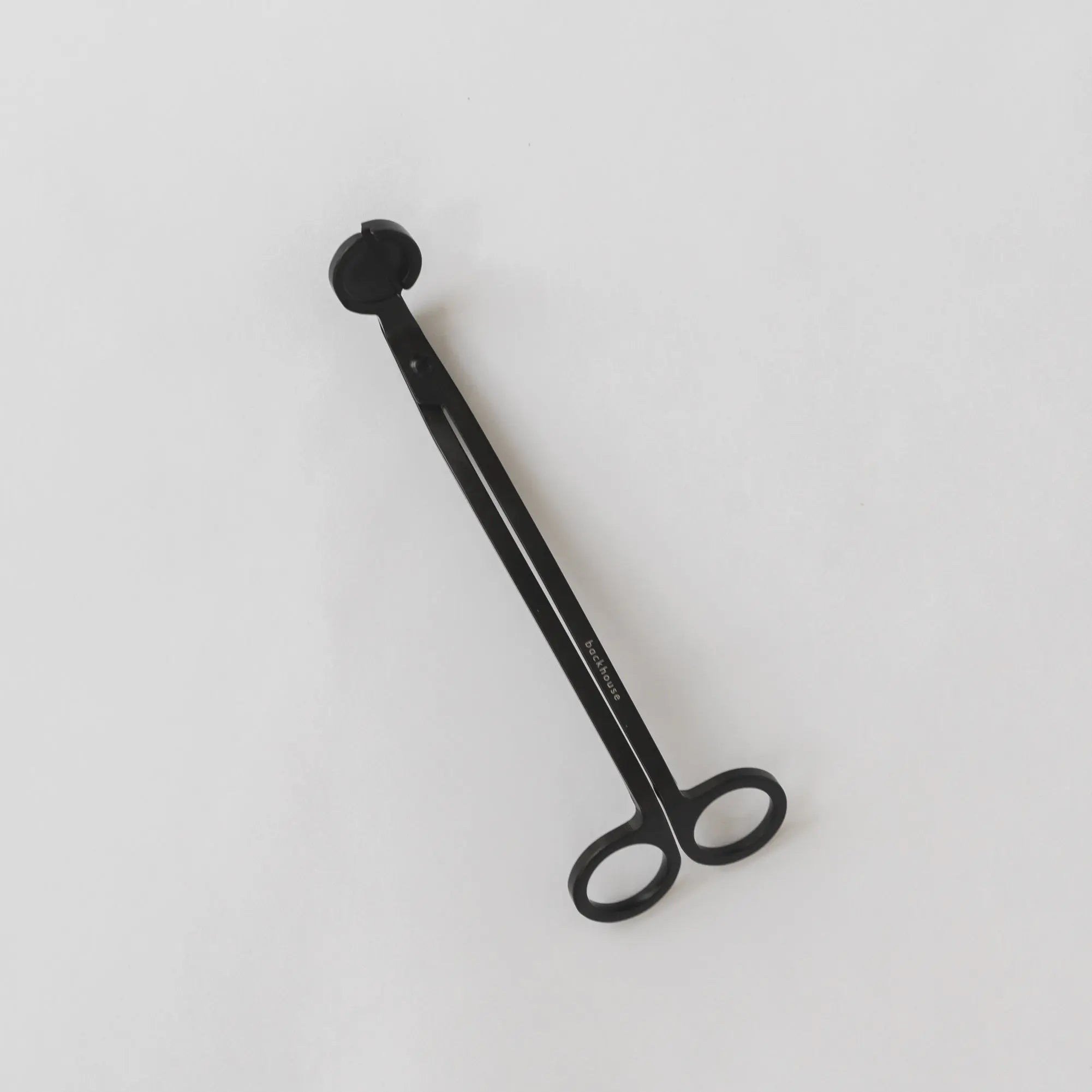 Black wick trimmer by backhouse displayed against a white background.