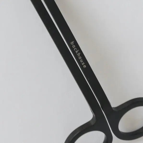 Close-up of the black wick trimmer by backhouse showing the trimming blades and handle detail.