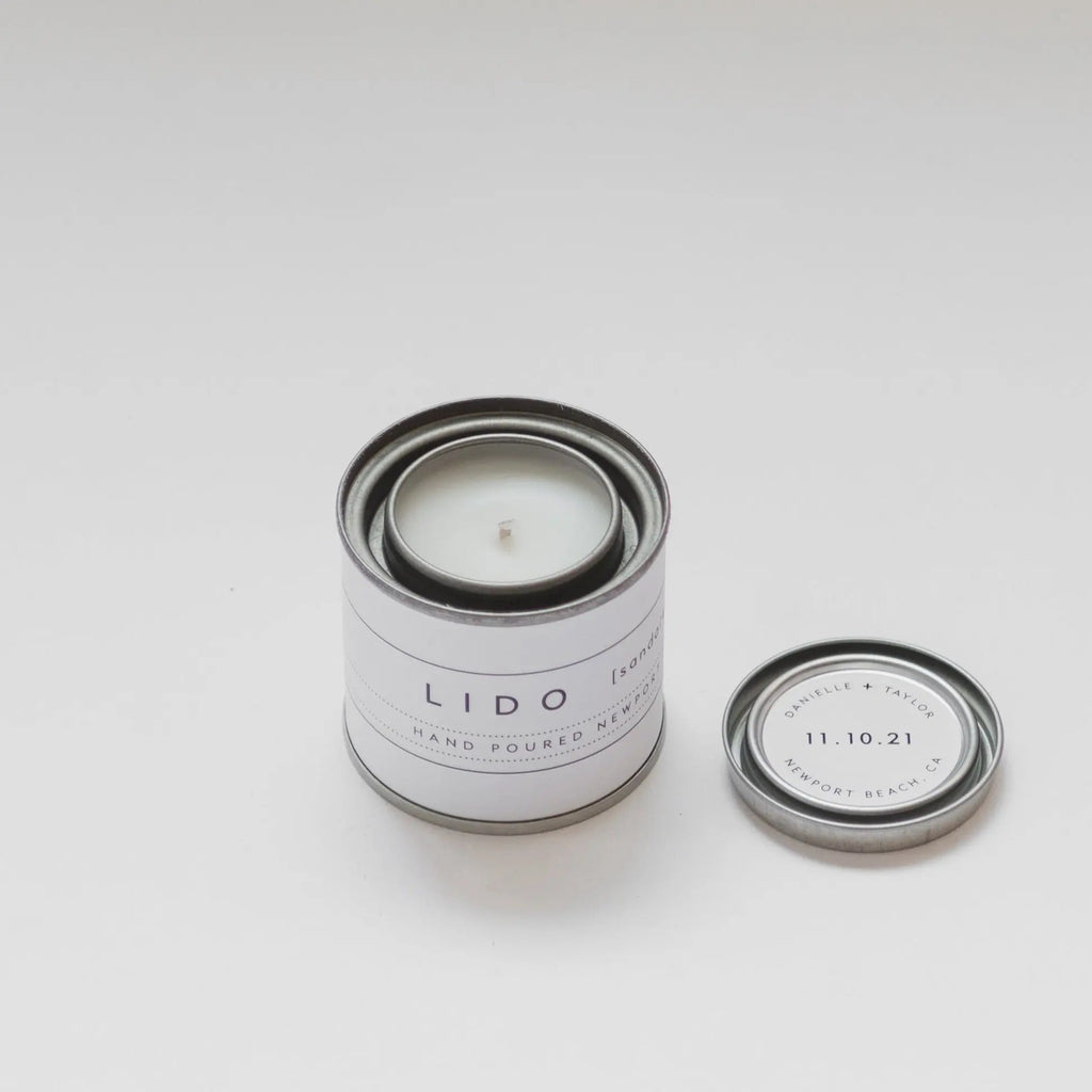Custom sandalwood scented Lido Newport hand-poured mini candle wedding favor with a personalized label for a modern wedding in Newport Beach.